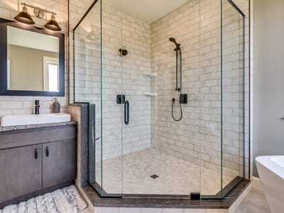 White subway tile and black matte shower head and fixtures